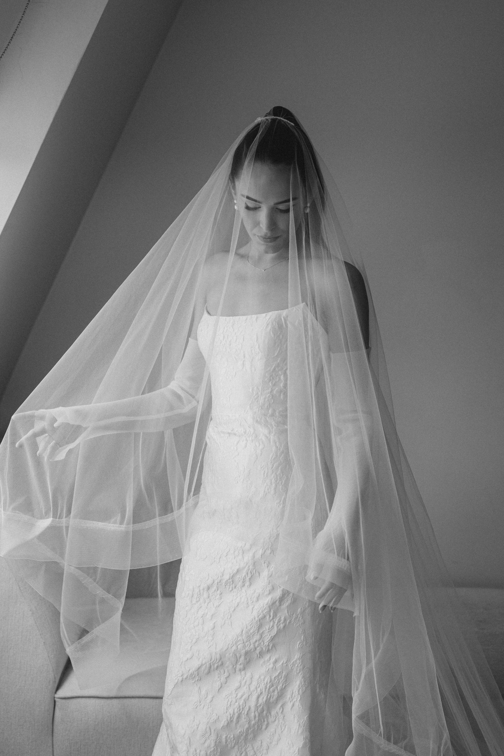 blusher cathedral bridal veil with horsehair trim edge on bride with high ponytail