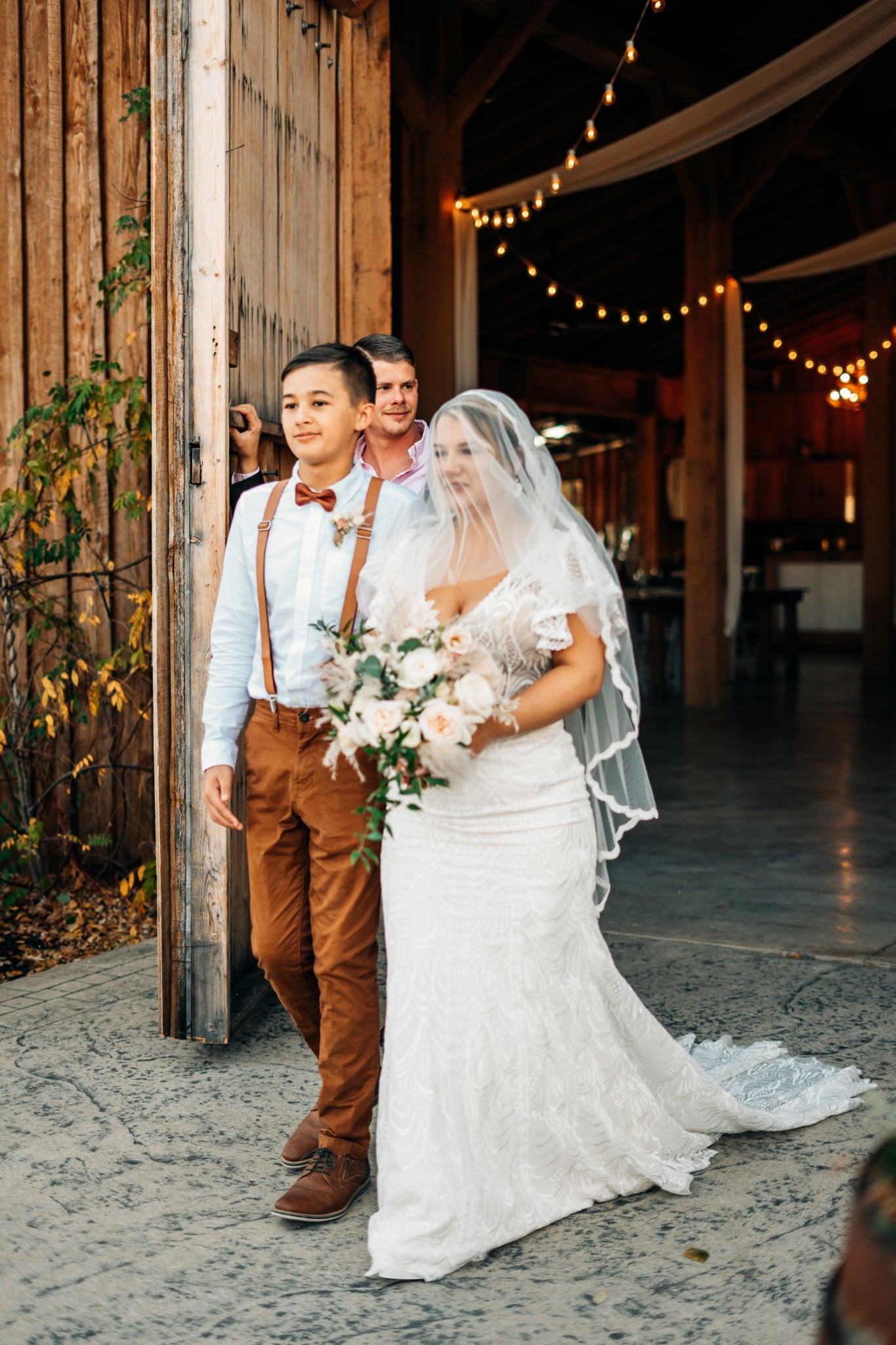 rustic barn wedding in burnt orange with blusher Juliet cap bridal veil over bride's face