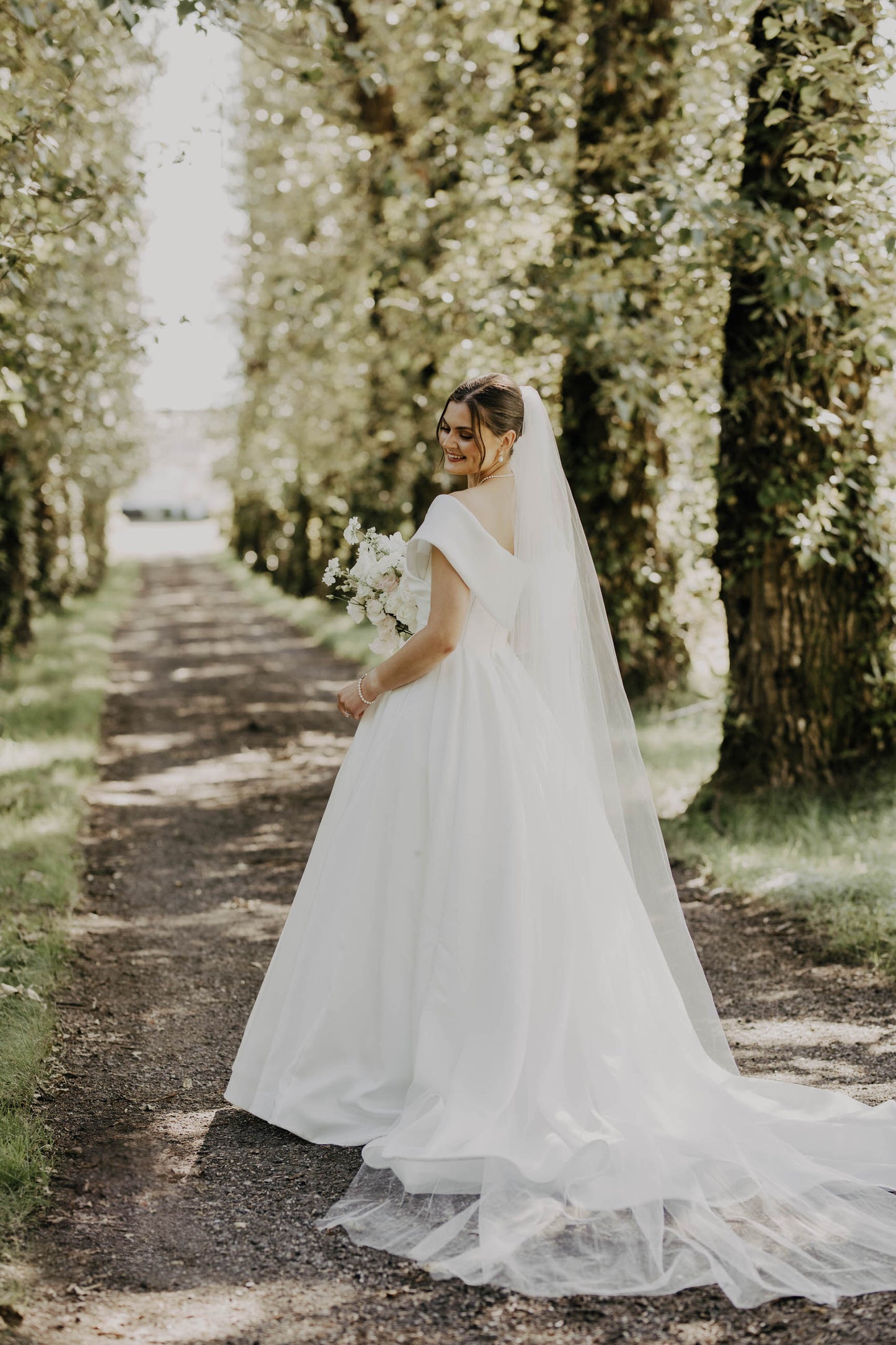 princess inspired wedding day look with long simple veil for fairytale woods bride