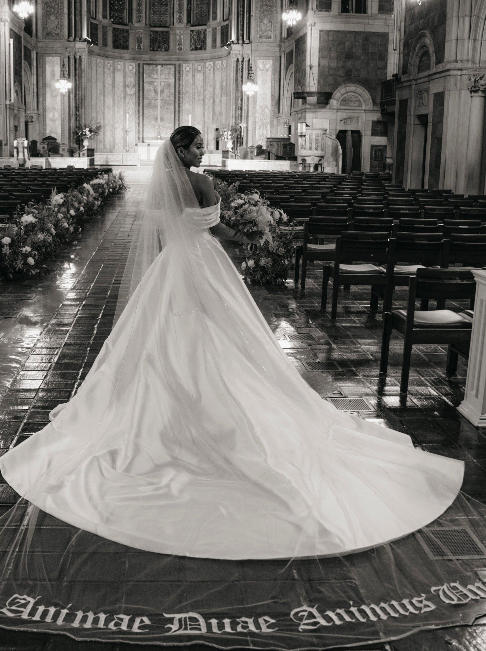 dramatic royal length bridal veil with custom embroidered phrase in latin for church wedding