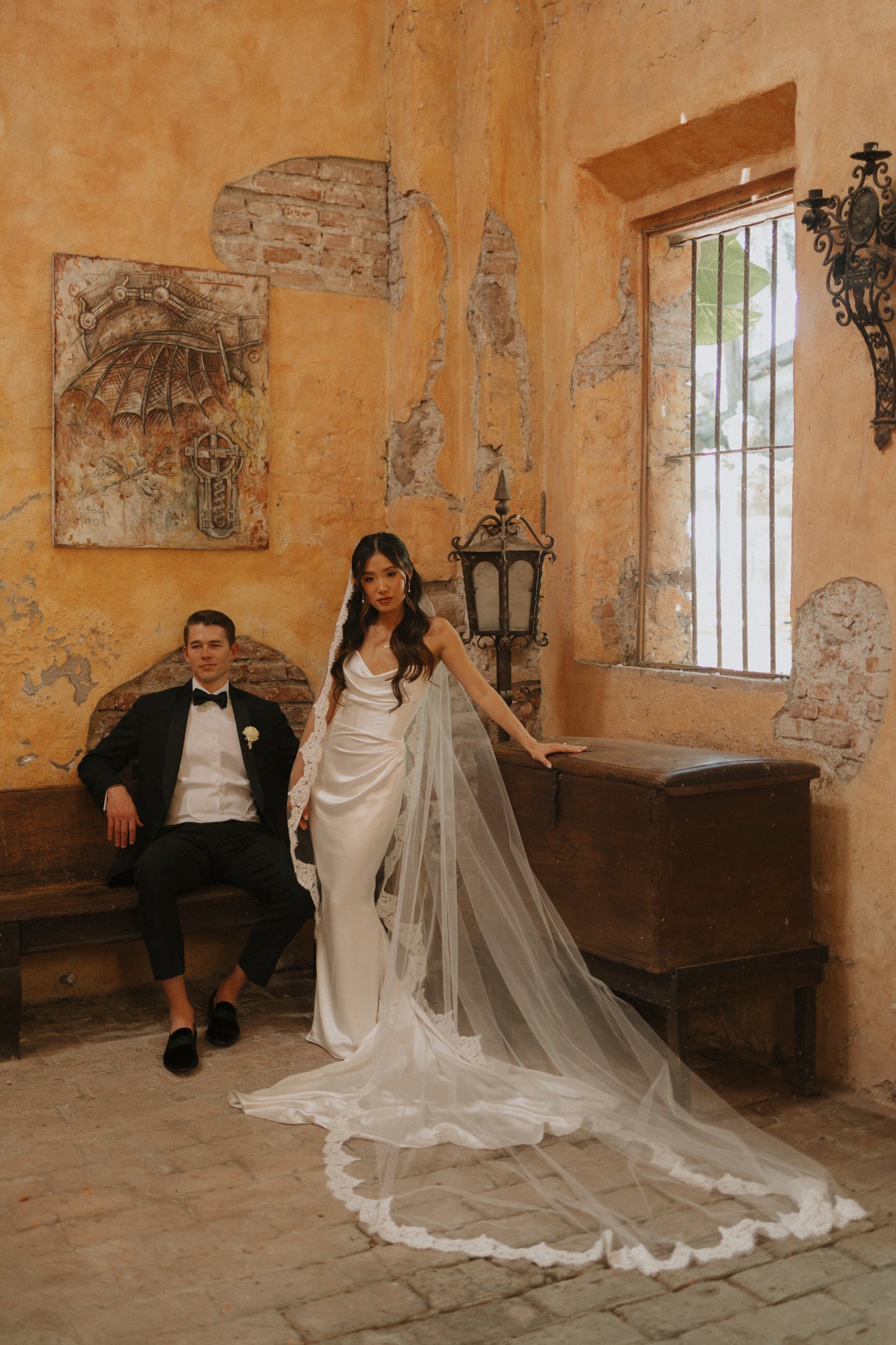 Mexico destination wedding with bride wearing long mantilla lace bridal veil from one blushing bride in adobe historic estate room,