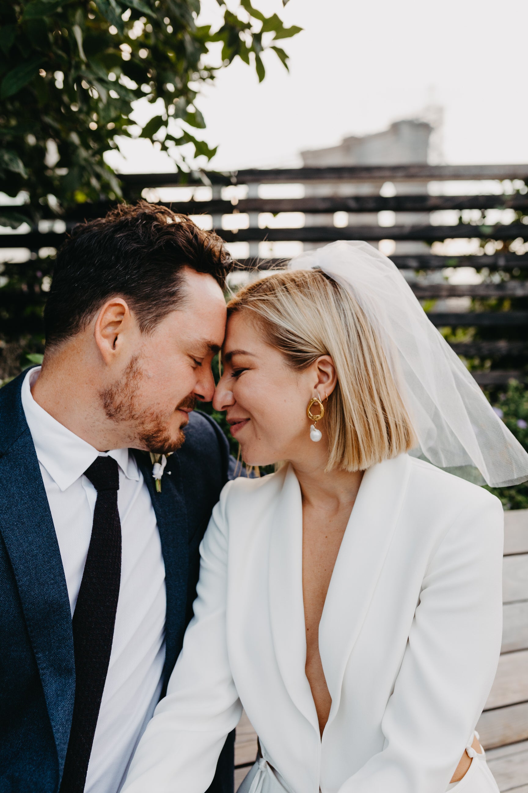 minimalist wedding day look with short birdcage bridal veil