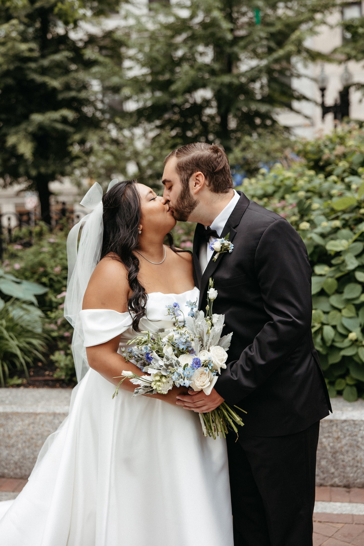 half up half down hairstyle with bridal hair bow veil