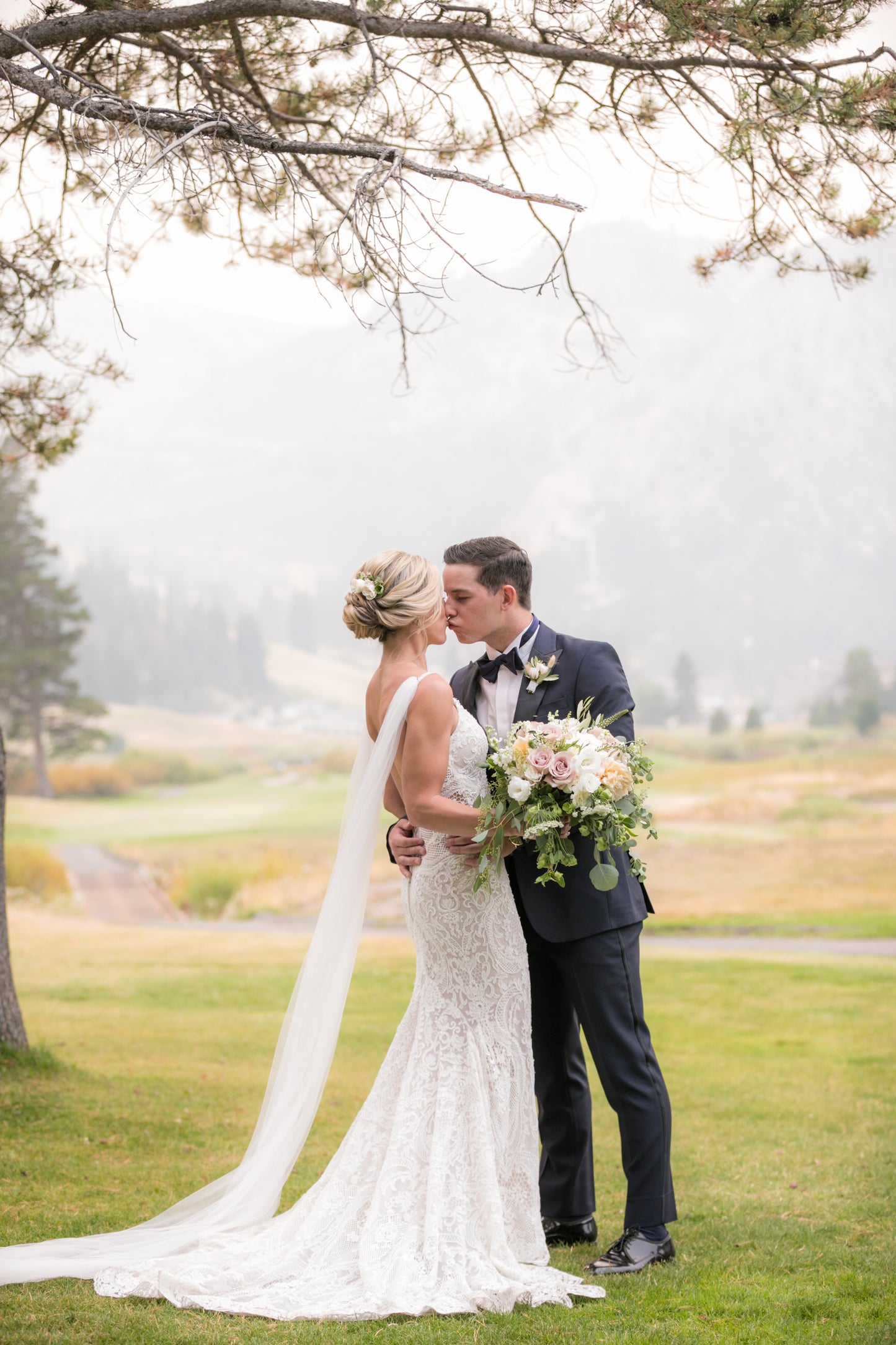 Northern California wedding with bride wearing white narrow tulle wing set