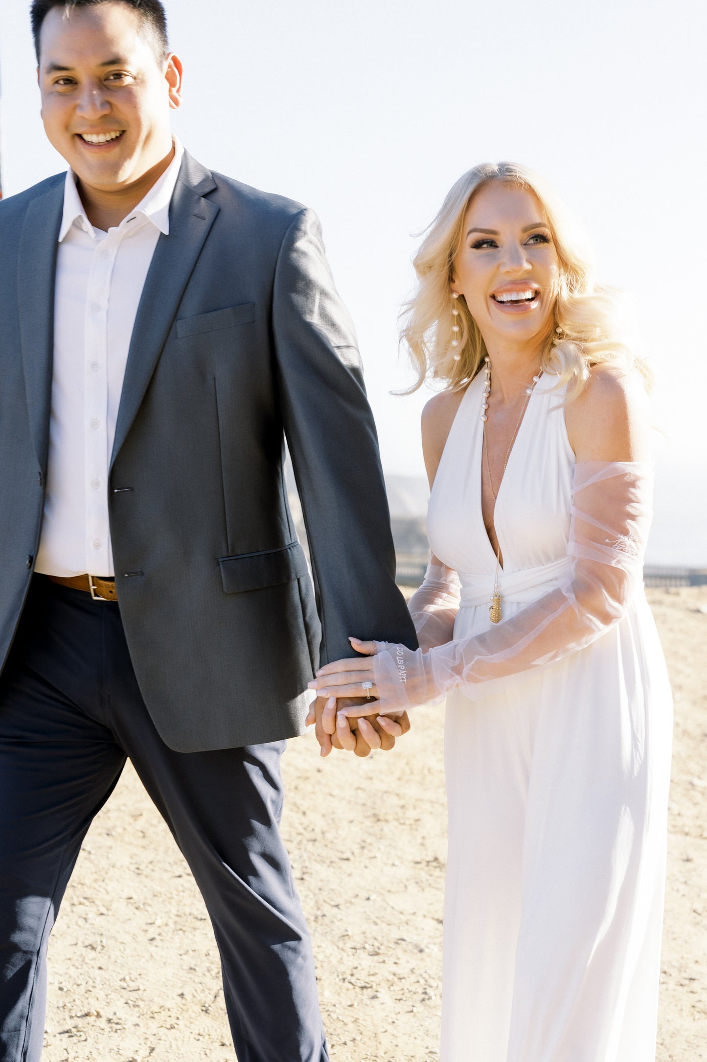 beach wedding day accessories for bride wearing long detachable glove set in white tulle
