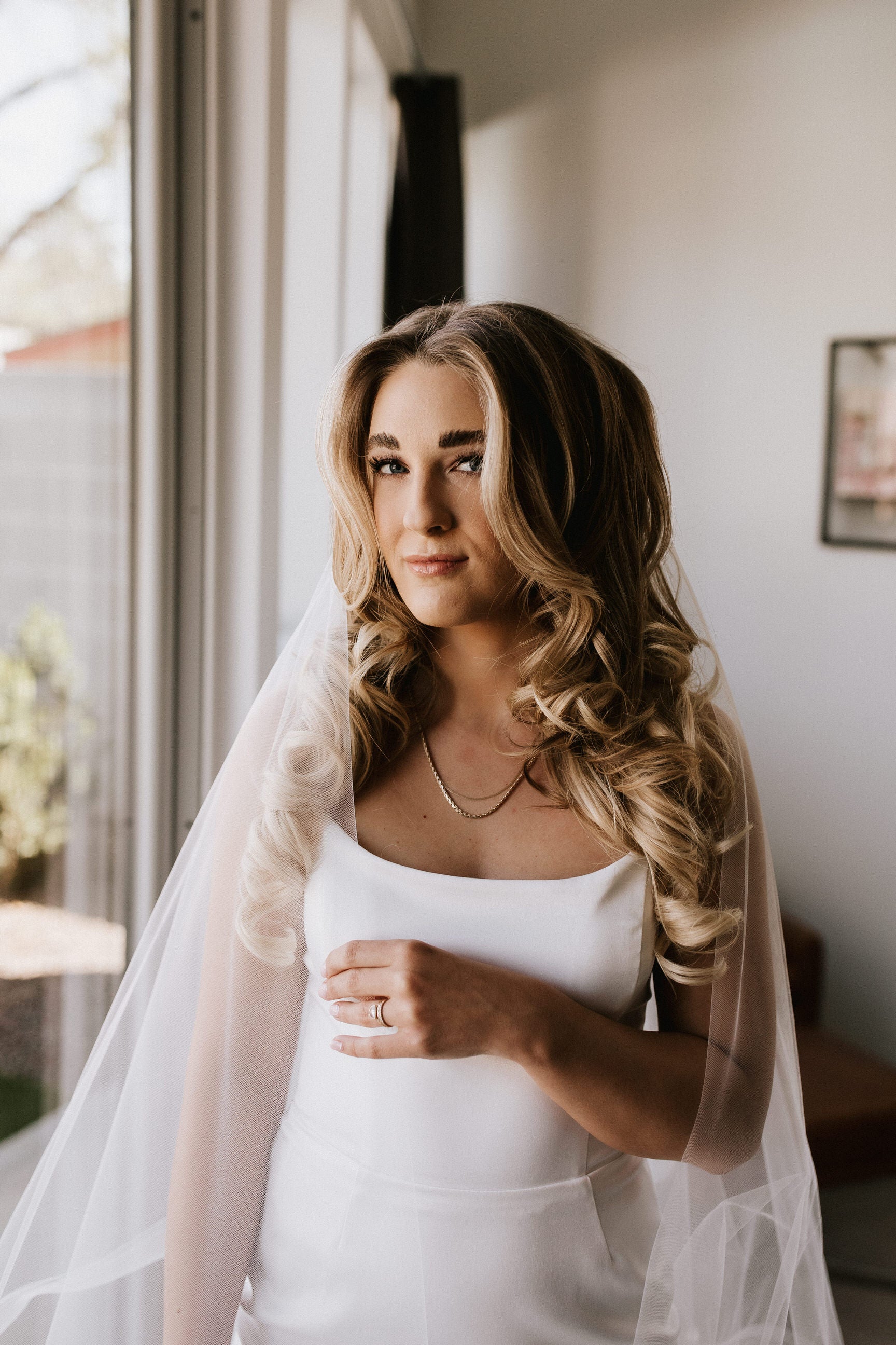loose hair down with simple wedding veil