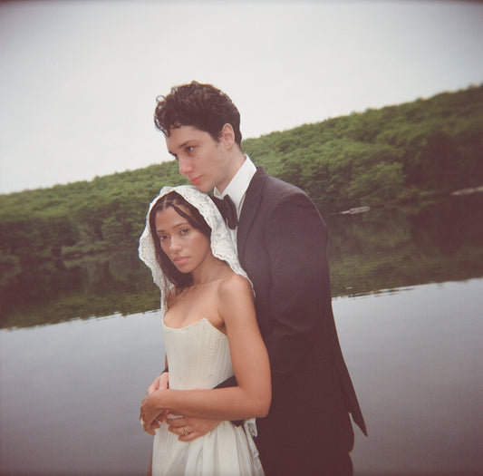 Italian bridal veil with cornrow hair on bride in corset gown