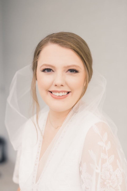 classic bride with bun and simple wedding veil redesigned and repurposed from mom's old wedding veil