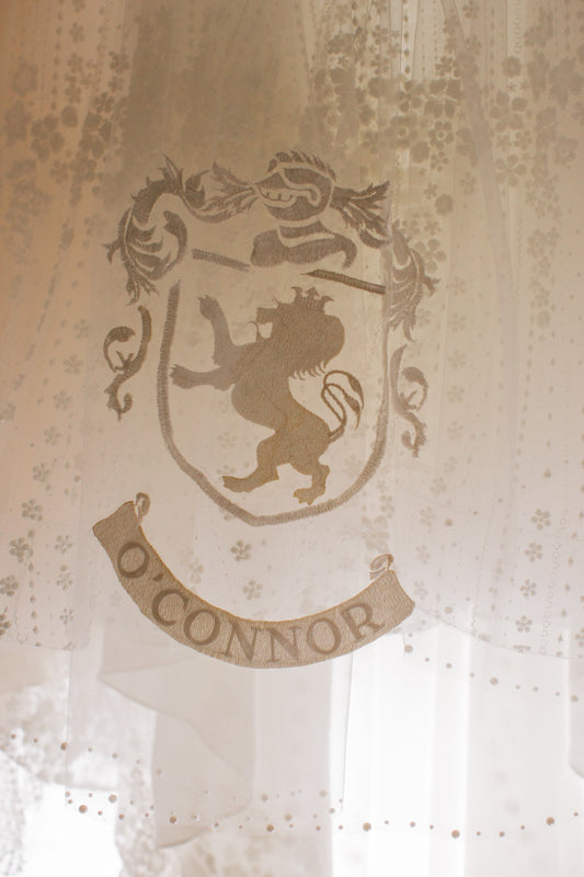 bespoke lion embroidery marriage crest on wedding veil with pearl edges