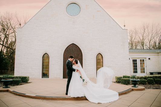 pink sunset mexican church photo of bride in long drop cathedral wedding veil with pearls