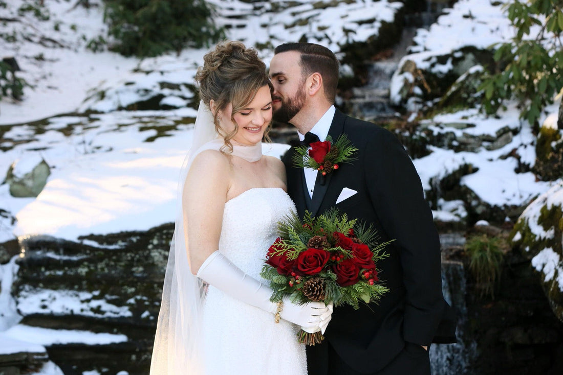 red rose bouquet with narrow tulle bridal scarf