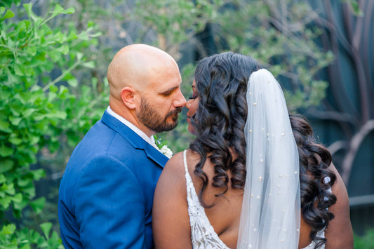 pearl studded long wedding veil in curly downdo