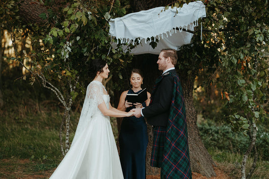ketubah jewish ceremony with scottish kilt and lace bridal cape on bride
