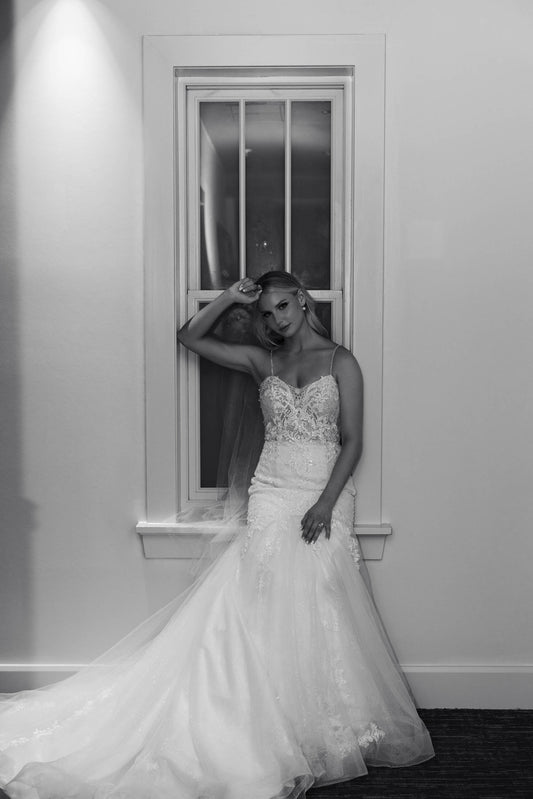 edgy bride in lace wedding dress with knee length wedding veil