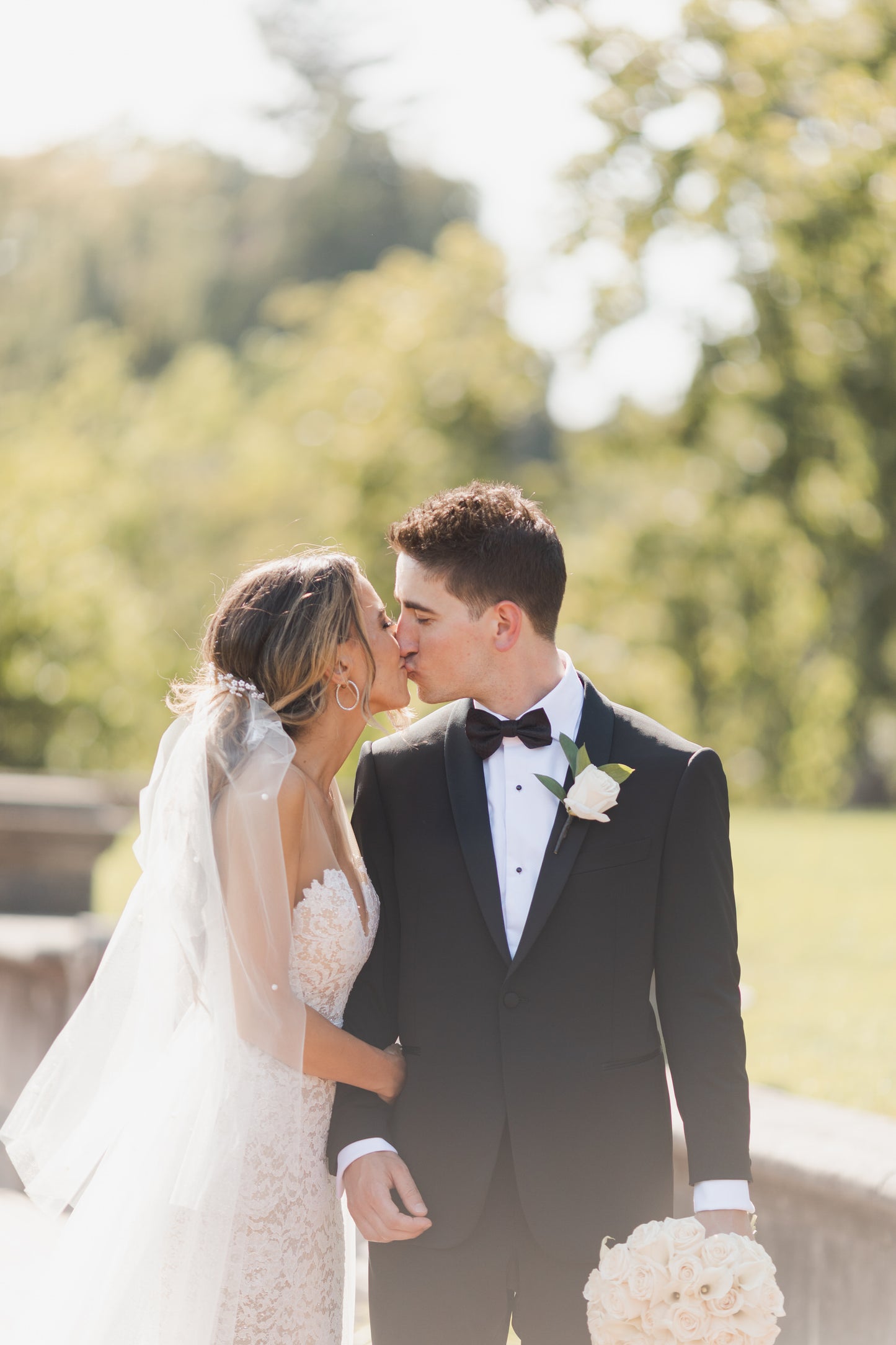 scattered pearl ponytail bridal veil for summer brides outside