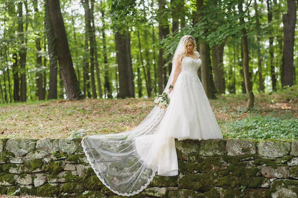 cathedral length lace edged veil and A line ballgown for forest outdoor wedding