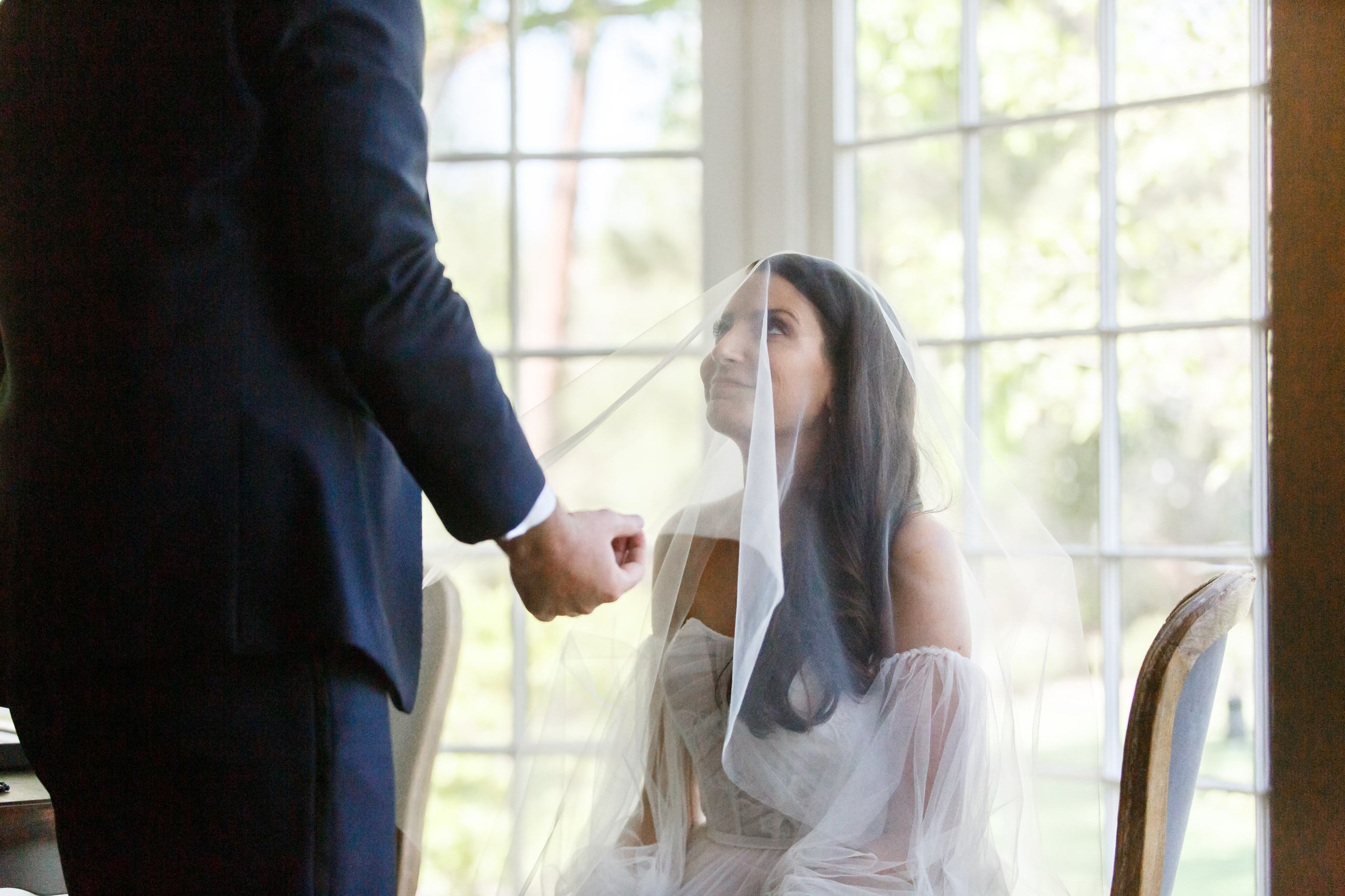Load video: brides wearing a long drop cathedral wedding veil with blusher