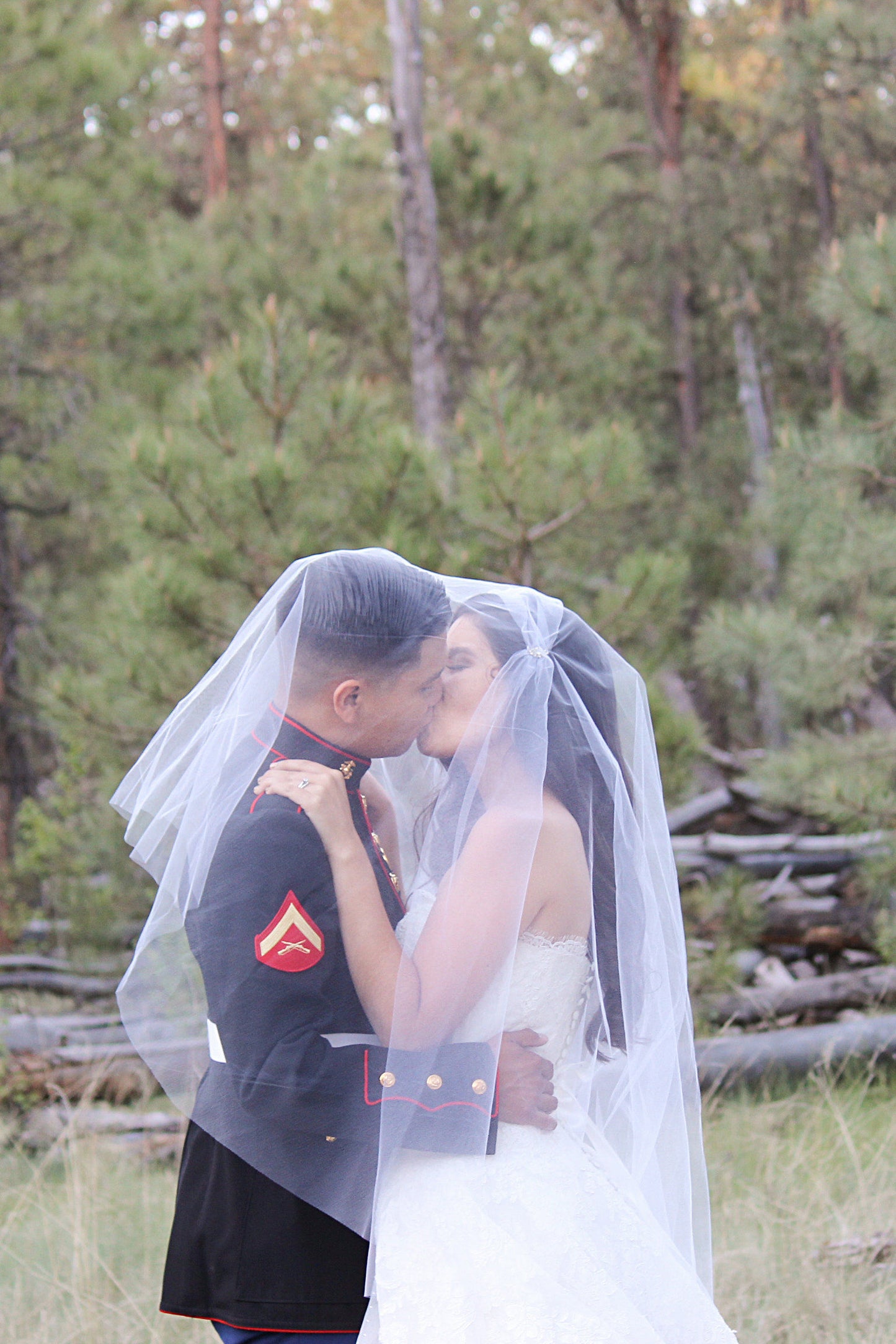 army wedding with Juliet cap blusher wedding veil over couple 