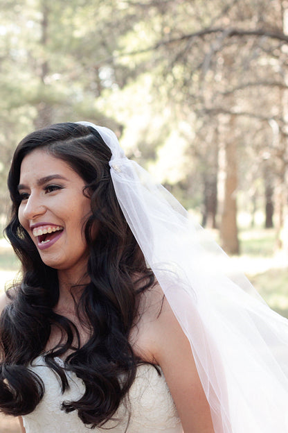 rhinestone beaded cap wedding veil with curled long hair on bride
