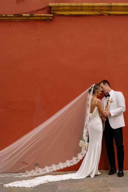 colorful Mexico wedding and bride wearing eyelash long wedding veil with lace trim