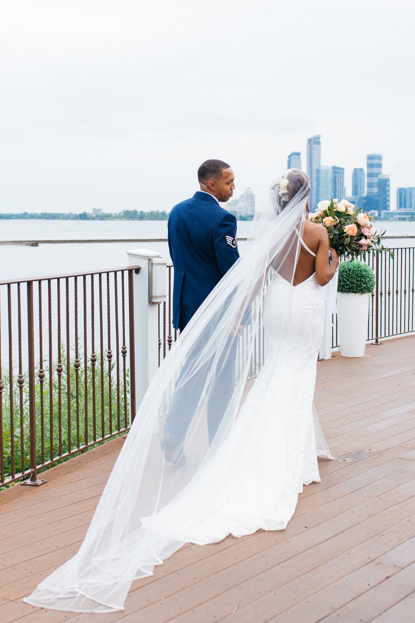 extra long royal length wedding veil with crystal edges over high updo
