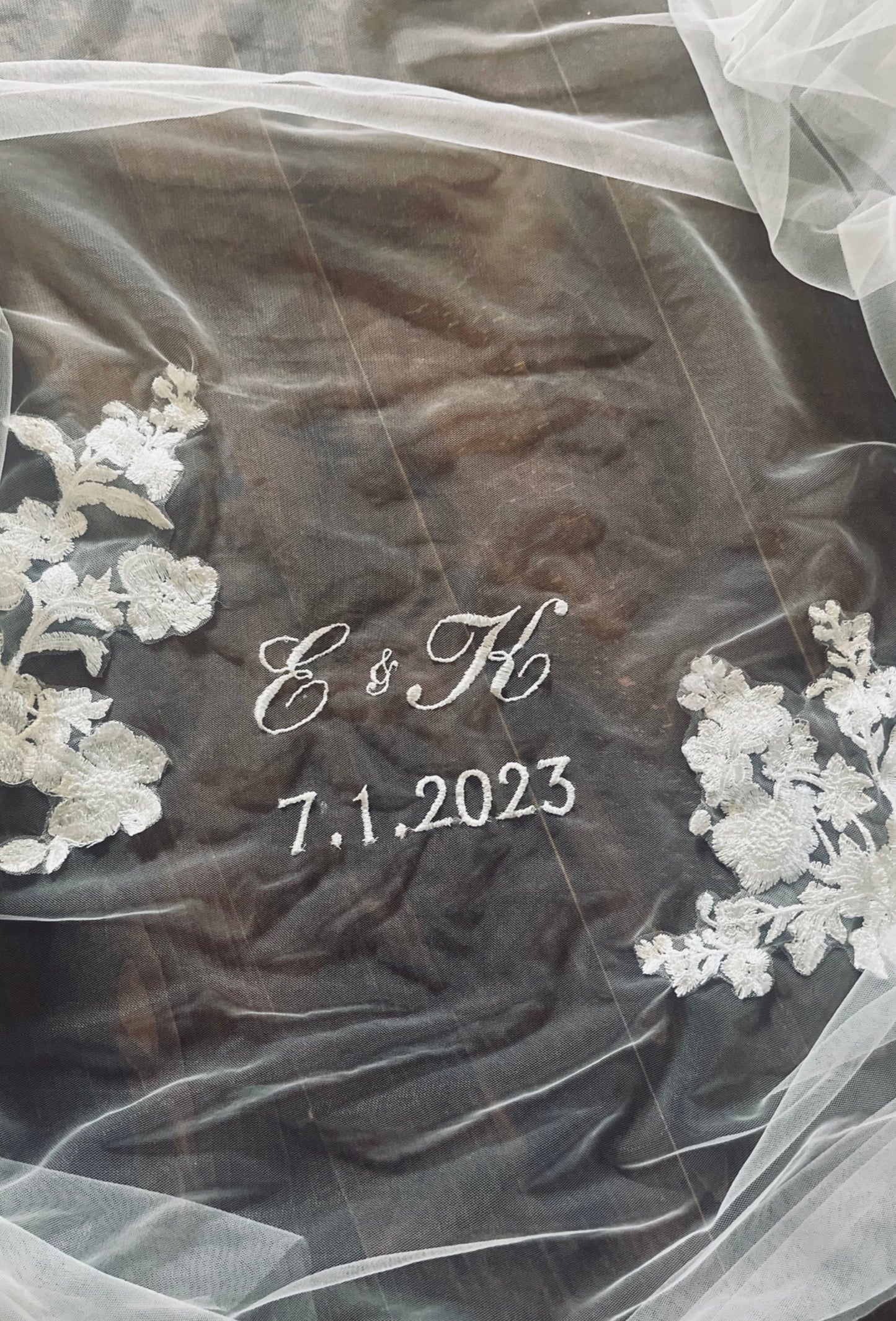 customized embroidered unity wedding veil with initials and wedding date encircled with French flower lace