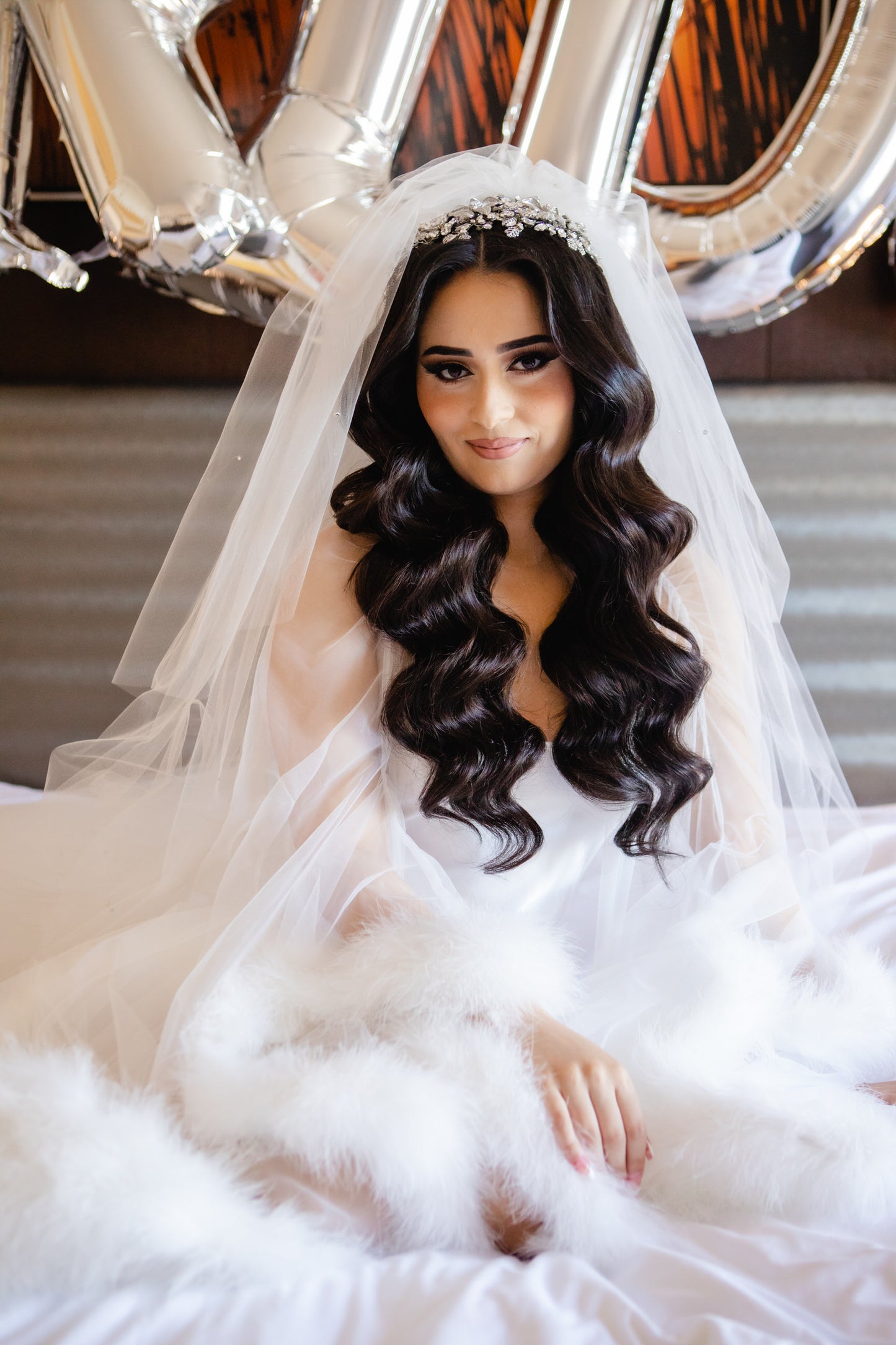extra full crystals bridal veil on bride wearing ruffle boa bridal robe