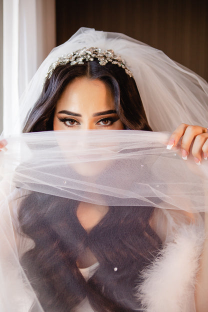 sparkly rhinestone diamond wedding veil on bride with French manicure and oversized crystal headband