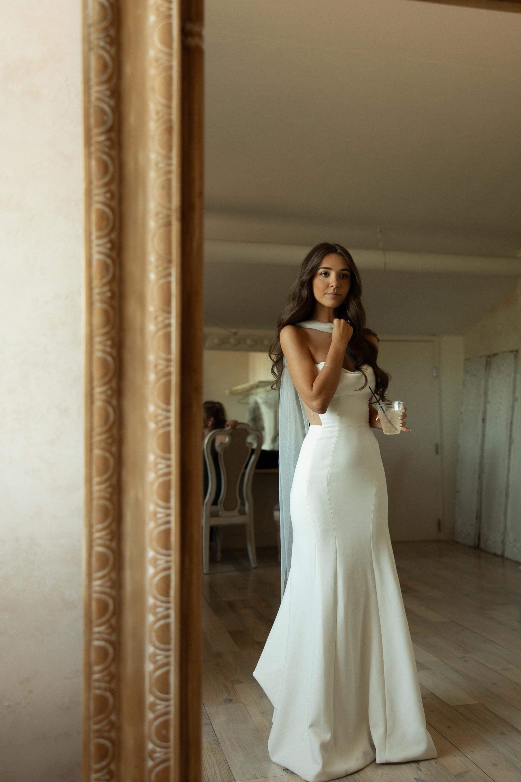 long elegant bridal scarf on bride in fitted strapless gown trumpet shape