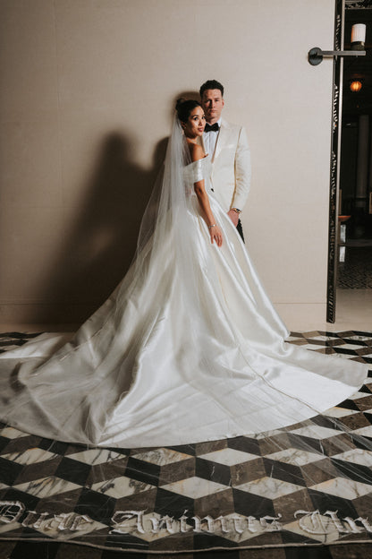 elegant long bridal veil with custom phrase embroidered on bottom and rhinestone trim