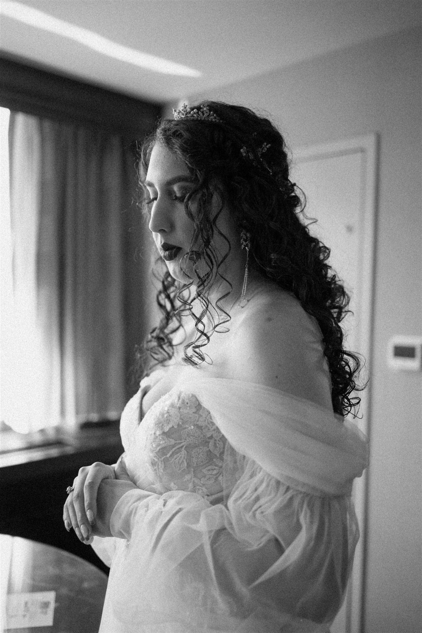 princess off the shoulder puffy balloon sleeves in sheer fabric on curly haired bride
