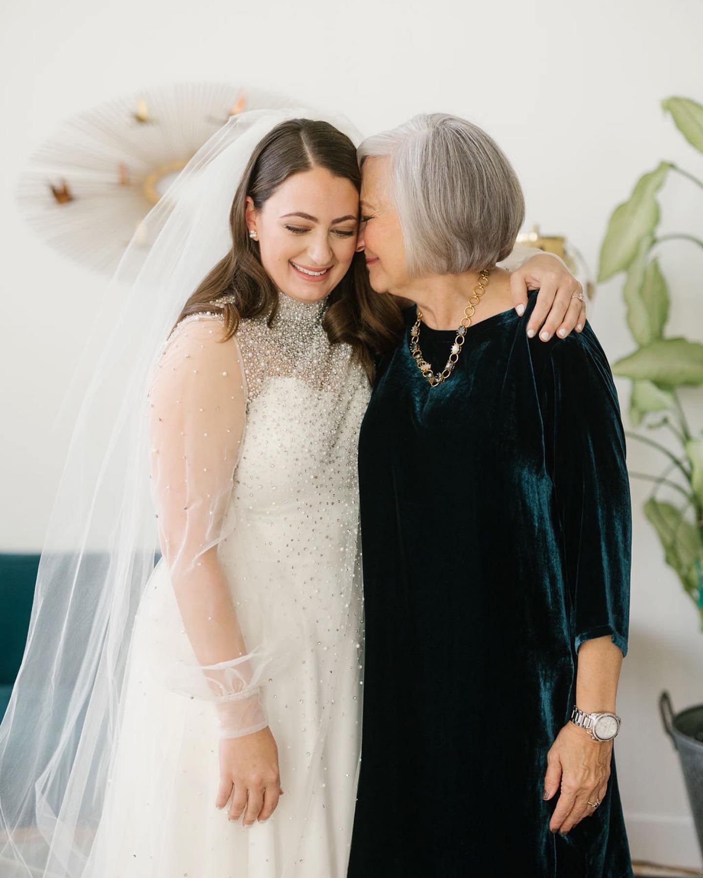 mom and grandma on wedding day with bride wearing Grandma's upcycled wedding veil