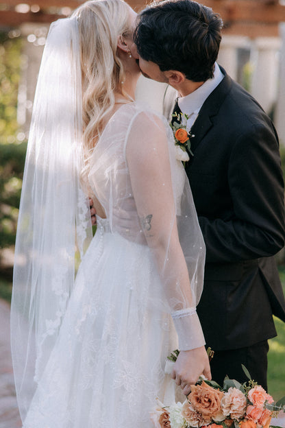 garden wedding with vine and leaf boho bridal veil and pearl tulle bridal sleeves