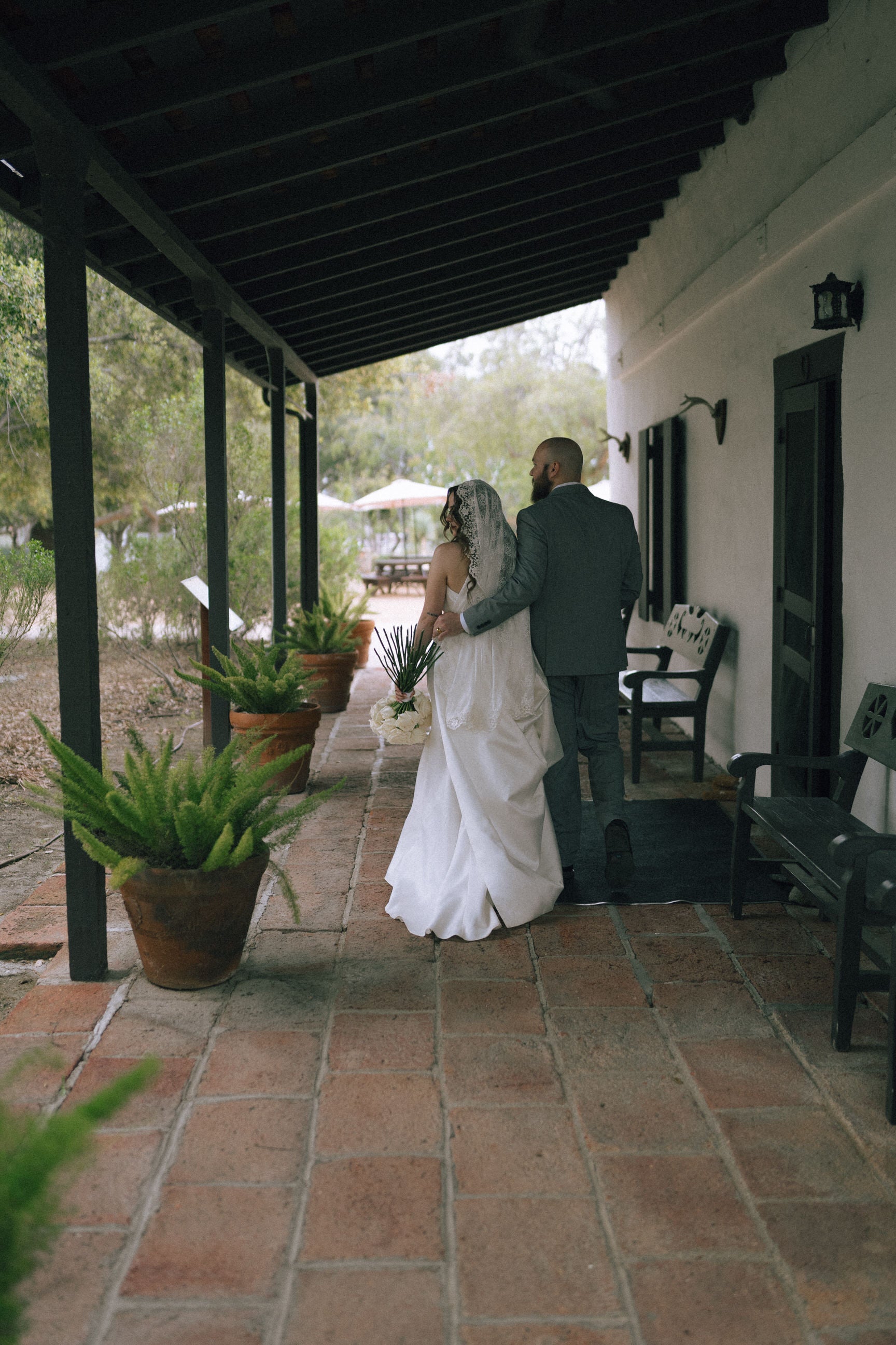hacienda estate wedding with mid length lace bridal veil mantilla style that frames face