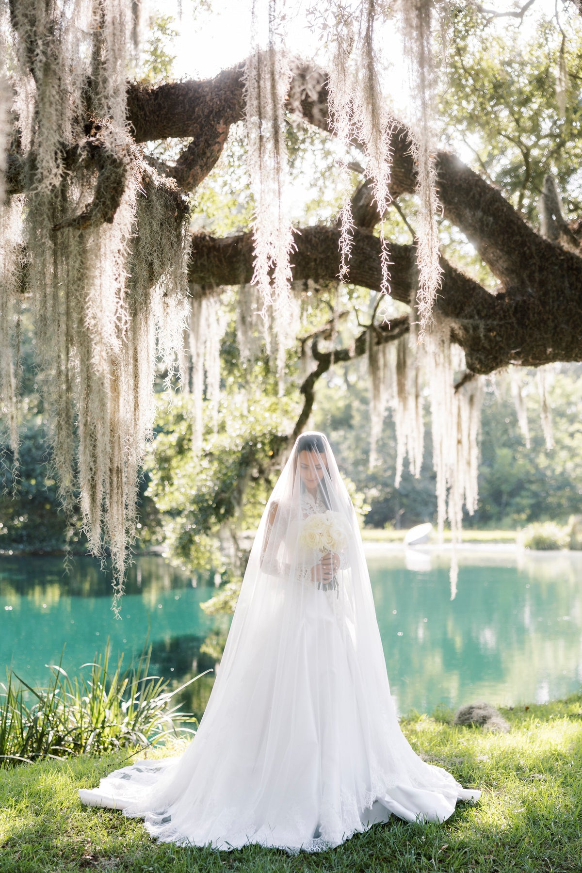 drop bridal veil on bride in custom long sleeve bridal cloak