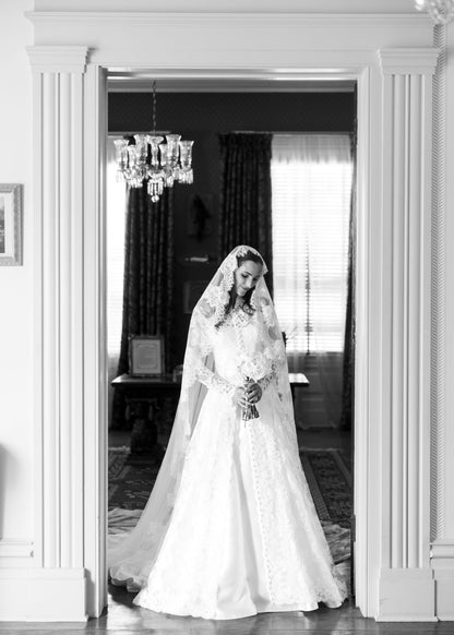 long sleeve lace bridal cape on bride in lace mantilla bridal veil