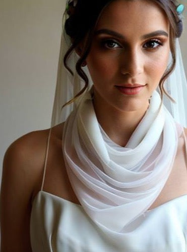 narrow bridal scarf around bride's neck with matching long bridal veil