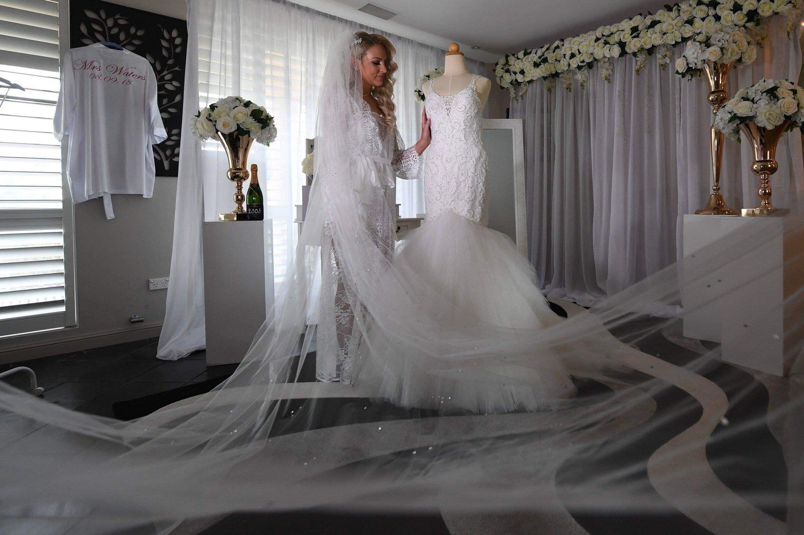 Load video: different brides wearing a long rhinestone cathedral wedding veil with crystals throughout on their wedding day