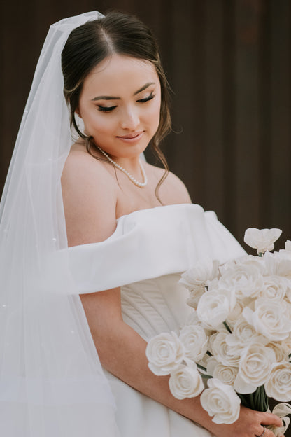 scattered pearl drop two layer wedding veil in bride's updo
