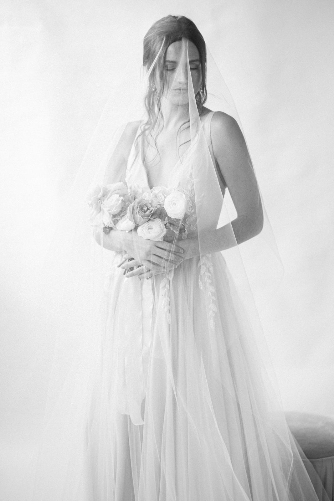 ethereal whimsical bridal veil with blusher and flowy V neck gown