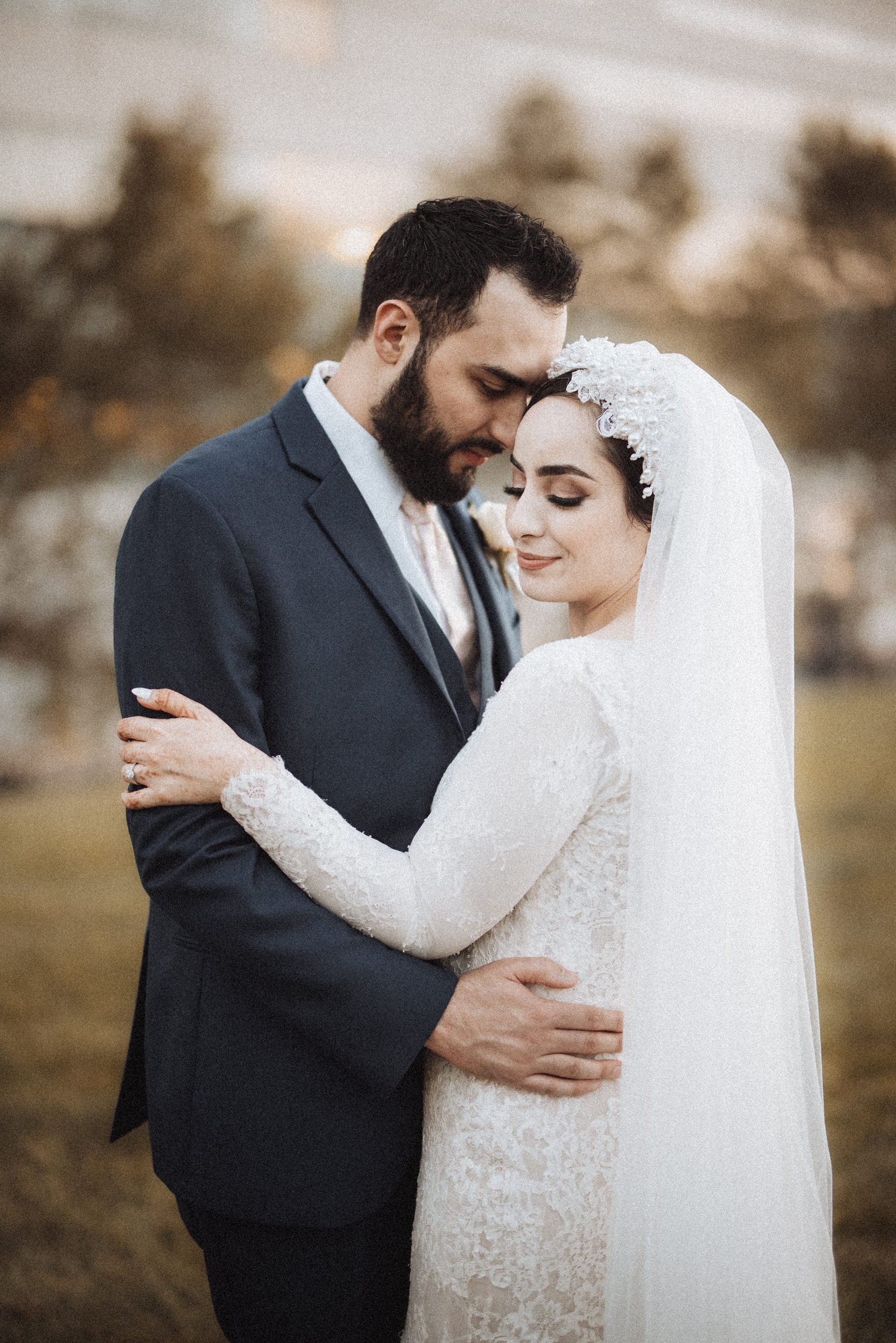 traditional headscarf with lace and pearls for hijabi bride with long cathedral veil attached