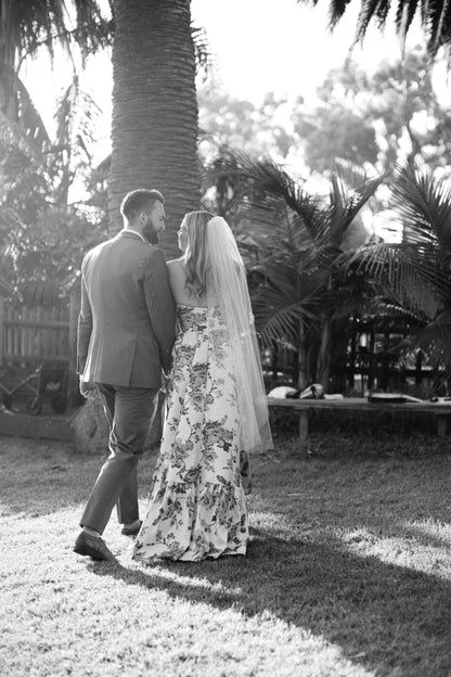botanical printed bridal gown with knee length wedding veil for outside wedding