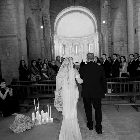 luxury all lace mantilla wedding veil on bride walking down church aisle 