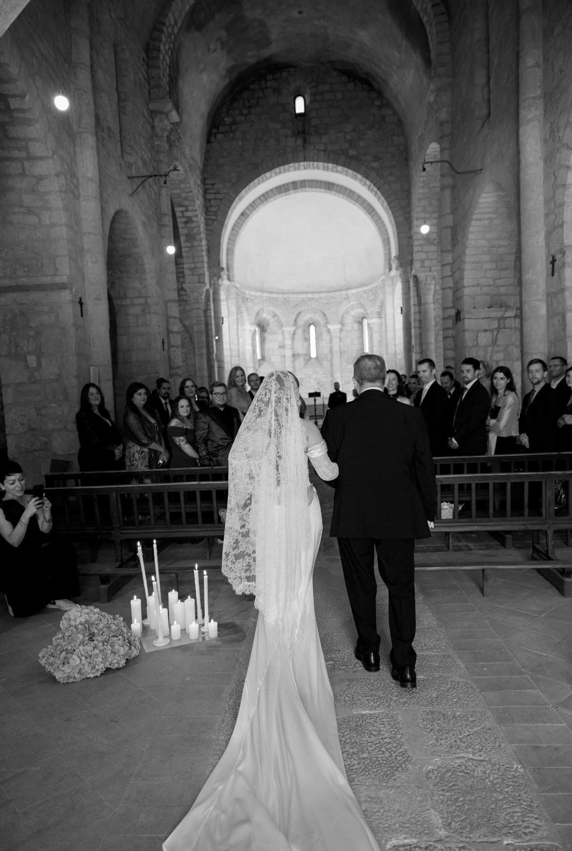 luxury all lace mantilla wedding veil on bride walking down church aisle 
