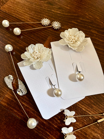 set of bridal veil bustles pins with flowers, crystals, and butterflies