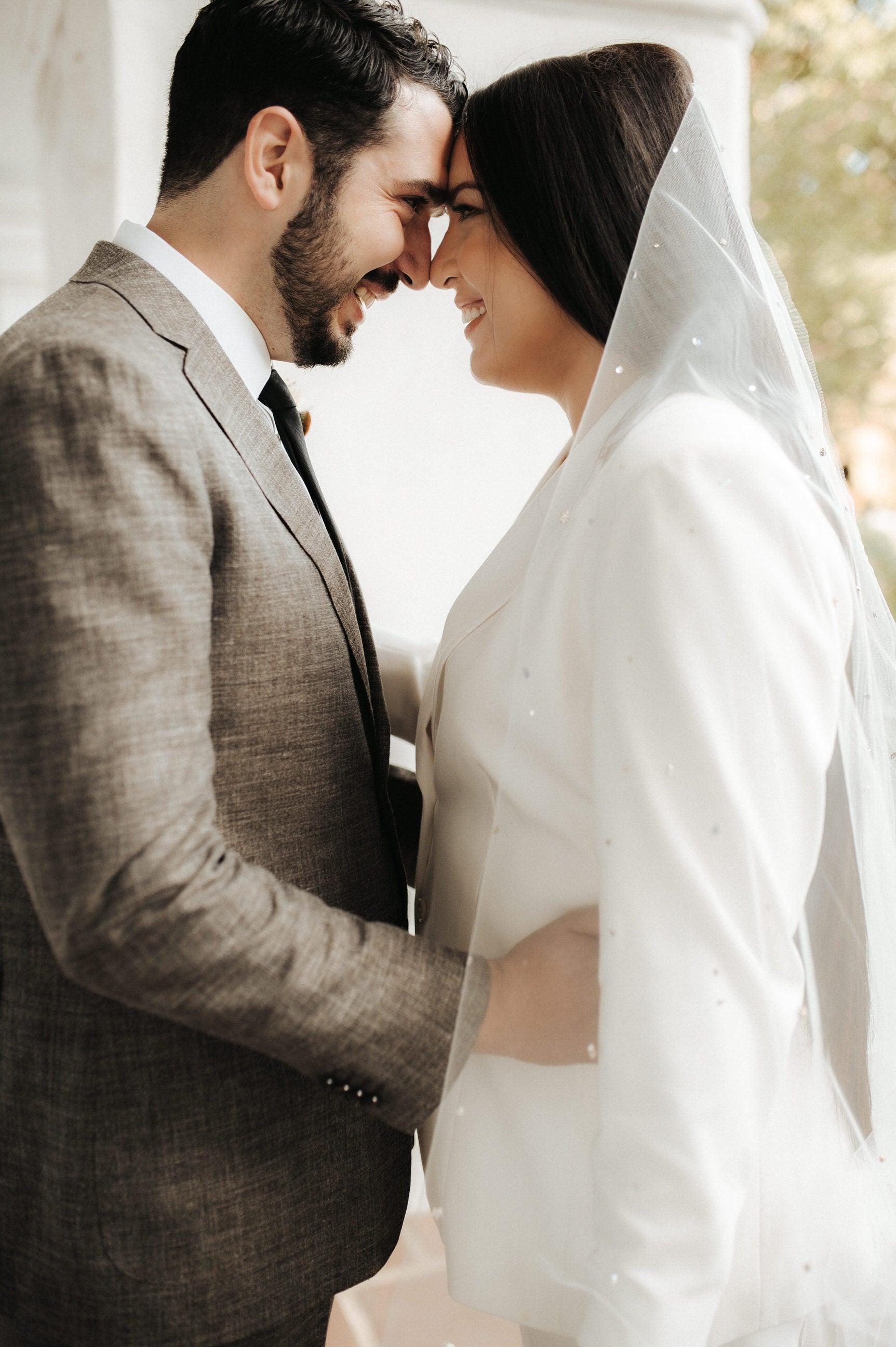 beaded rhinestone wedding veil on bride with long straight hair