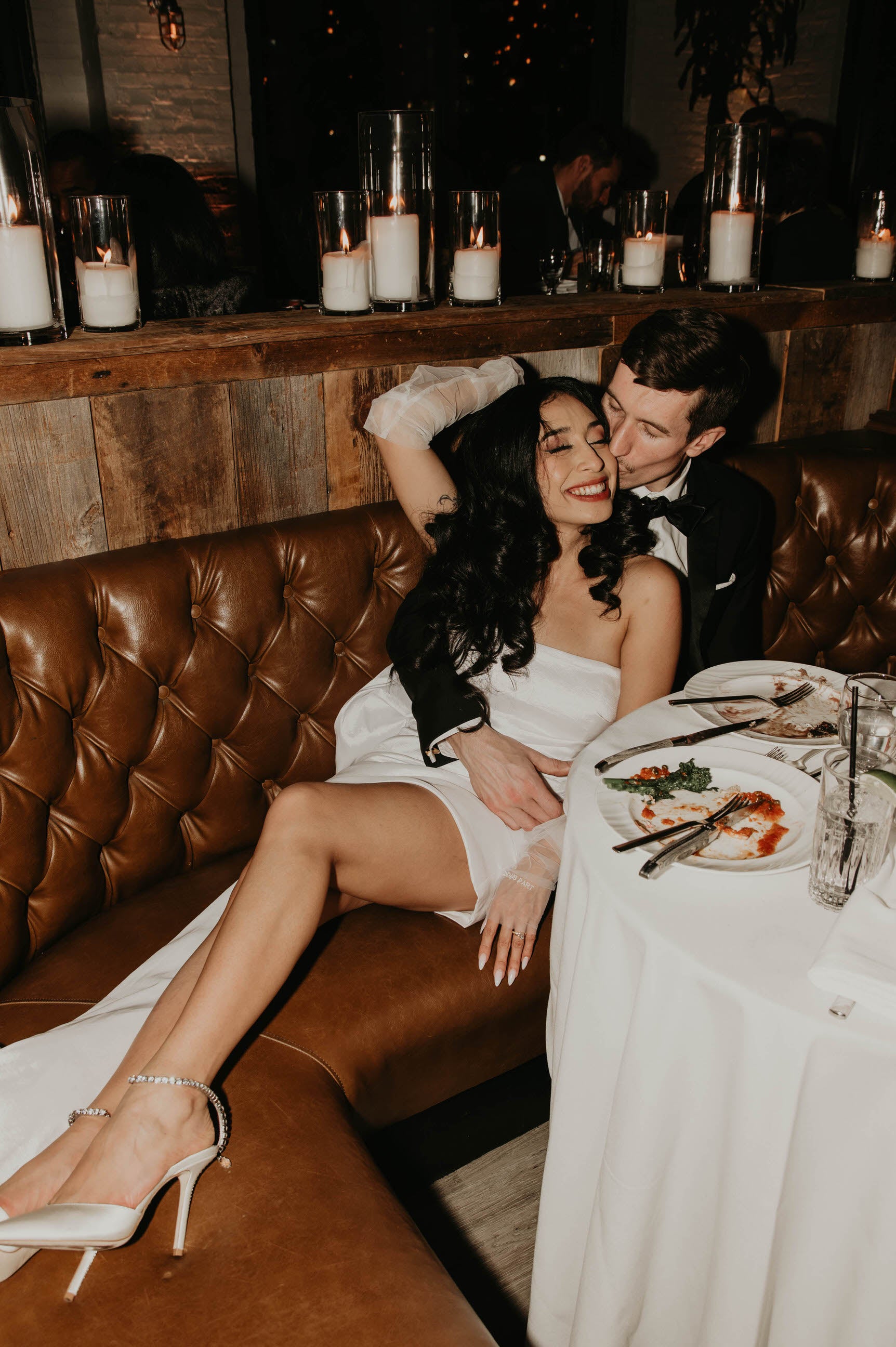 long glove set in white on bride in short dress and heels at reception