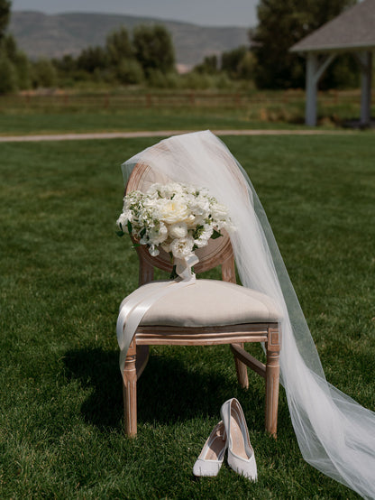 white long simple veil with bridal pumps and white wedding bouquet