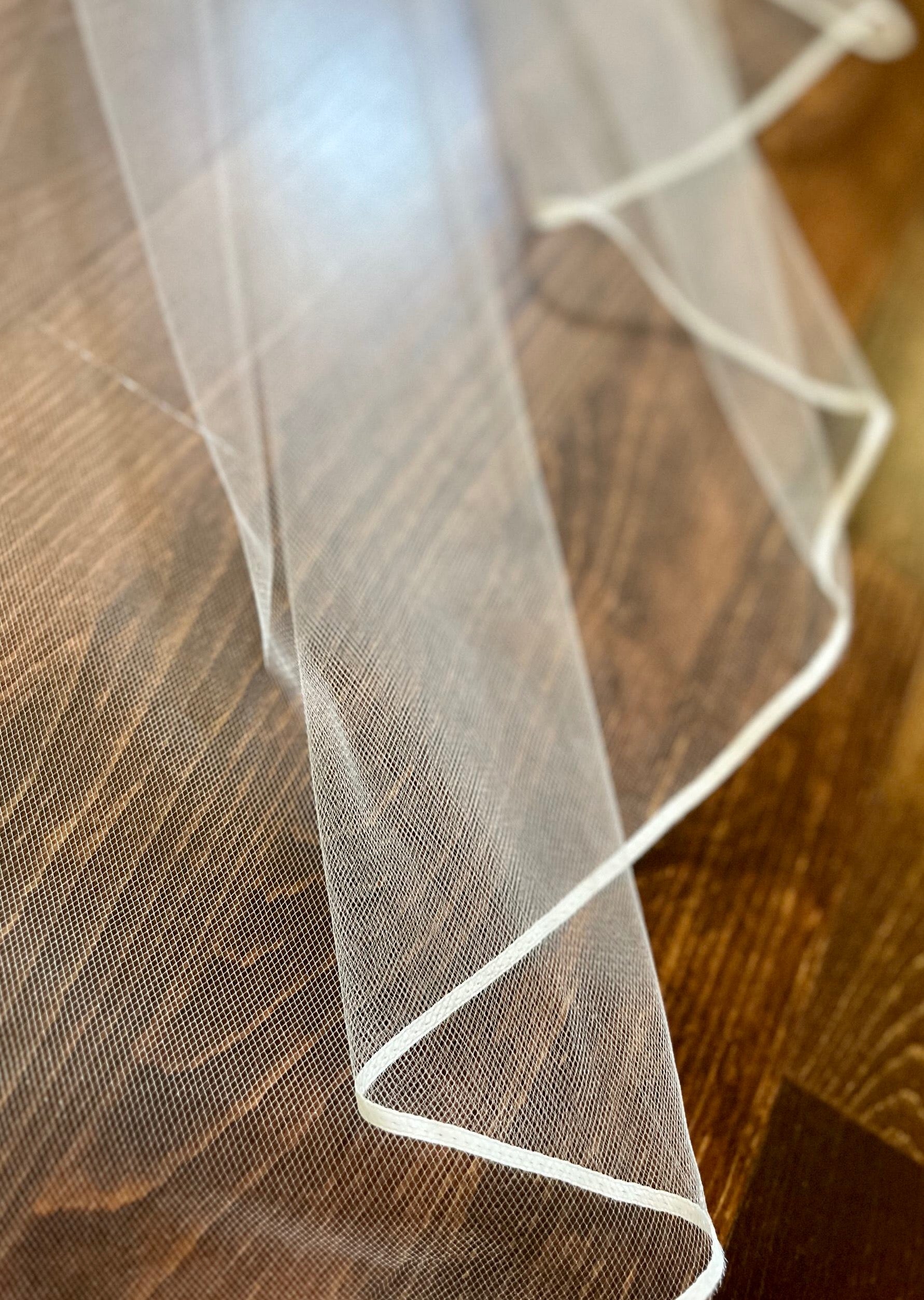 one eight inch thin narrow ribbon edging on bridal veil in california