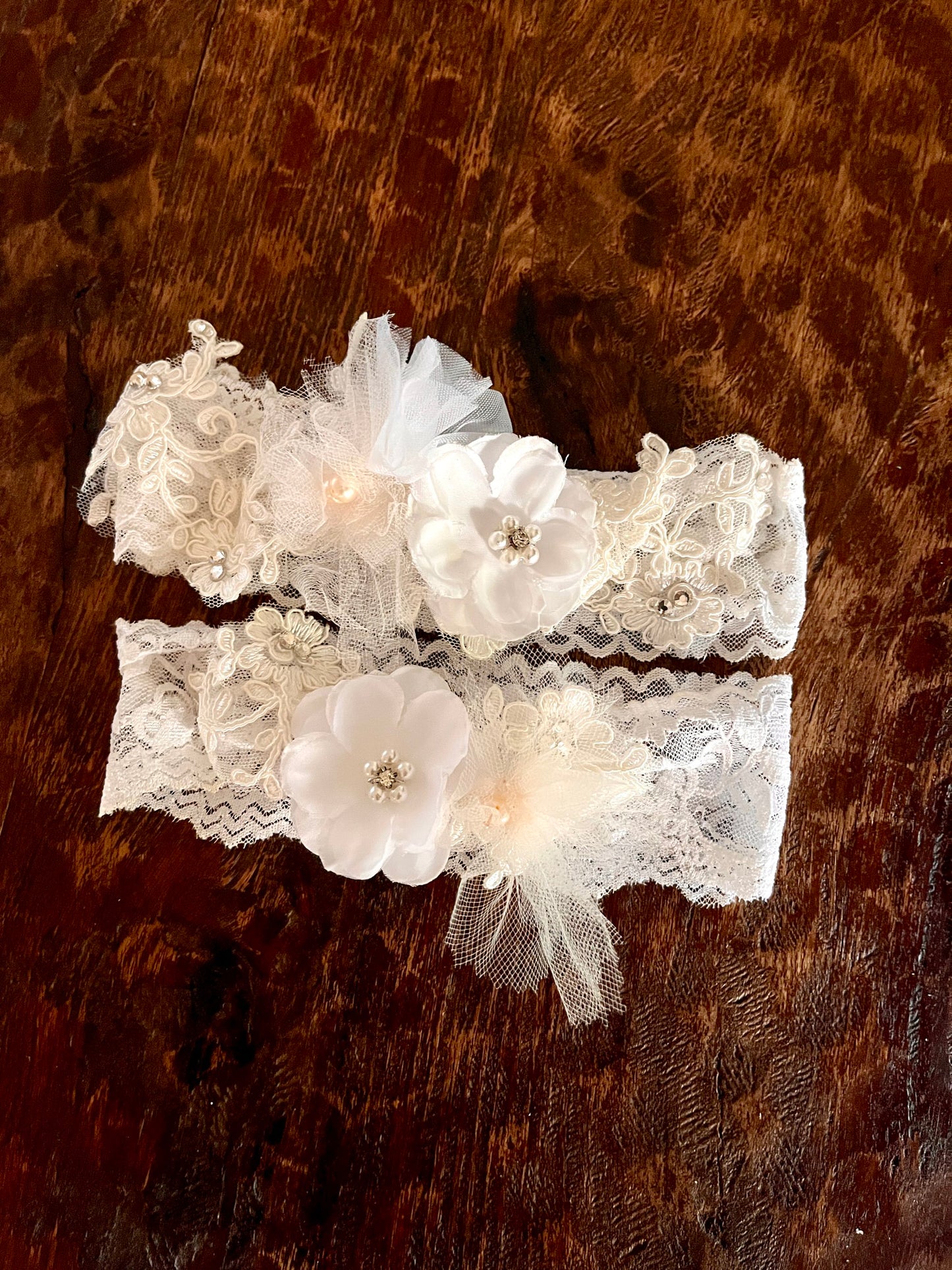 up cycled lace bridal garter set in blush with flowers from mom's vintage wedding dress from the 1970s